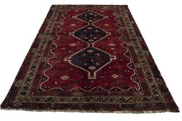 Surface texture of 2000s Shiraz rug with natural Wool and intricate pattern