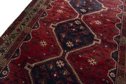Backside of handmade 2000s Shiraz rug showing knot structure and weave density
