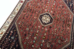 Backside of handmade 2000s Shiraz rug showing knot structure and weave density