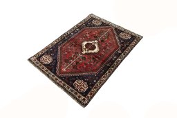 Corner detail of 2000s Shiraz rug showing border pattern and Wool pile