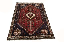 Surface texture of 2000s Shiraz rug with natural Wool and intricate pattern