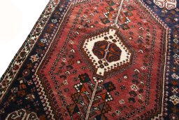 Backside of handmade 2000s Shiraz rug showing knot structure and weave density