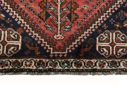 Close-up detail of 2000s Shiraz rug from Iran / Persia showing Wool weave