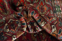 Corner detail of 2000s Shiraz rug showing border pattern and Wool pile