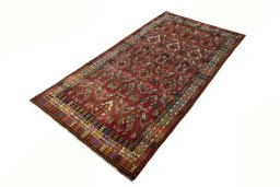 Corner detail of 2000s Shiraz rug showing border pattern and Wool pile
