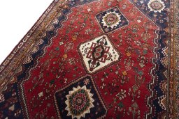 Backside of handmade 2000s Shiraz rug showing knot structure and weave density