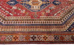 Corner detail of 2000s Shiraz rug showing border pattern and Wool pile