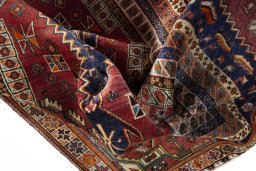 Surface texture of 2000s Shiraz rug with natural Wool and intricate pattern