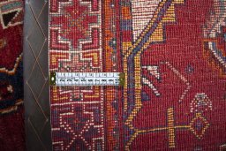 Backside of handmade 2000s Shiraz rug showing knot structure and weave density
