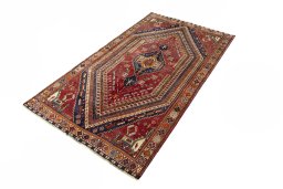 Corner detail of 2000s Shiraz rug showing border pattern and Wool pile