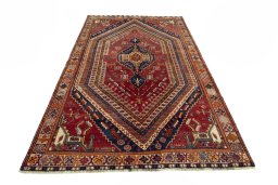 Surface texture of 2000s Shiraz rug with natural Wool and intricate pattern