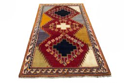 Surface texture of 2000s Shiraz rug with natural Wool and intricate pattern