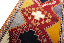 Backside of handmade 2000s Shiraz rug showing knot structure and weave density