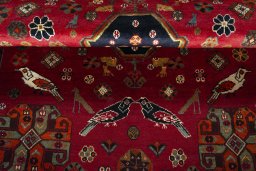 Corner detail of 2000s Shiraz rug showing border pattern and Wool pile