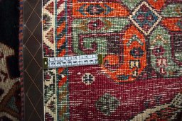 Surface texture of 2000s Shiraz rug with natural Wool and intricate pattern