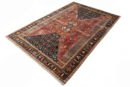 Corner detail of 2000s Shiraz rug showing border pattern and Wool pile