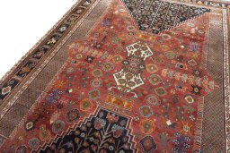 Backside of handmade 2000s Shiraz rug showing knot structure and weave density