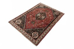 Corner detail of 2000s Shiraz rug showing border pattern and Wool pile