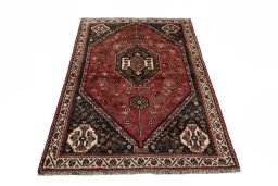 Surface texture of 2000s Shiraz rug with natural Wool and intricate pattern