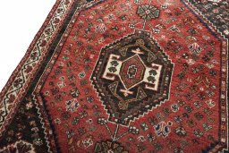 Backside of handmade 2000s Shiraz rug showing knot structure and weave density