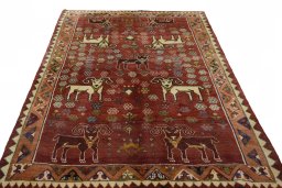 Surface texture of 2000s Shiraz rug with natural Wool and intricate pattern