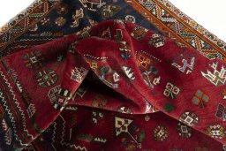 Surface texture of 2000s Shiraz rug with natural Wool and intricate pattern