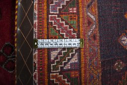 Backside of handmade 2000s Shiraz rug showing knot structure and weave density