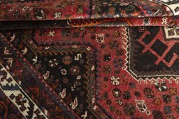 Close-up detail of 2000s Shiraz rug from Iran / Persia showing Wool weave