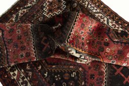 Surface texture of 2000s Shiraz rug with natural Wool and intricate pattern