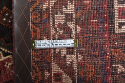 Backside of handmade 2000s Shiraz rug showing knot structure and weave density