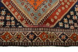 Central medallion detail of 2000s Shiraz rug from Iran / Persia