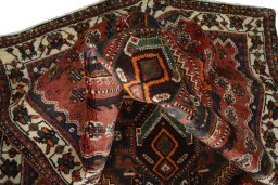 Corner detail of 2000s Shiraz rug showing border pattern and Wool pile