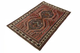 Corner detail of 2000s Shiraz rug showing border pattern and Wool pile