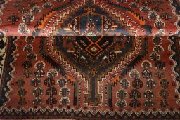 Full view of 2000s Shiraz rug from Iran / Persia, 160 × 104 cm in Red tones