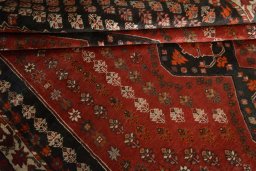 Full view of 1970s Shiraz rug from Iran / Persia, 255 × 174 cm in Red tones