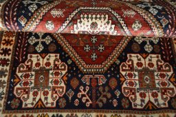 Corner detail of 2000s Shiraz rug showing border pattern and Cotton pile