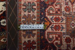 Surface texture of 2000s Shiraz rug with natural Cotton and intricate pattern
