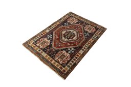 Corner detail of 2000s Shiraz rug showing border pattern and Cotton pile