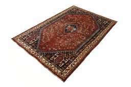 Corner detail of 2000s Shiraz rug showing border pattern and Wool pile