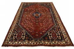 Surface texture of 2000s Shiraz rug with natural Wool and intricate pattern