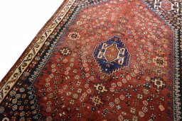 Backside of handmade 2000s Shiraz rug showing knot structure and weave density