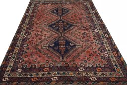 Surface texture of 2000s Shiraz rug with natural Wool and intricate pattern