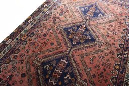 Backside of handmade 2000s Shiraz rug showing knot structure and weave density