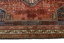 Corner detail of 2000s Shiraz rug showing border pattern and Wool pile