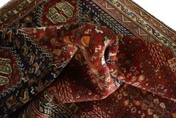 Surface texture of 2000s Shiraz rug with natural Wool and intricate pattern