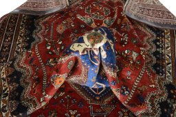 Corner detail of 2000s Shiraz rug showing border pattern and Wool pile