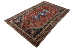 Corner detail of 2000s Shiraz rug showing border pattern and Wool pile