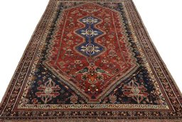 Surface texture of 2000s Shiraz rug with natural Wool and intricate pattern