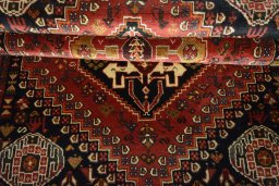 Full view of 2000s Shiraz rug from Iran / Persia, 182 × 121 cm in Red tones