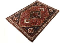 Corner detail of 2000s Shiraz rug showing border pattern and Wool pile